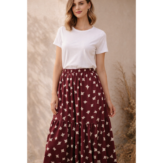 Bordeauxfarbener ECOVERO Viskosestoff mit grafischem Punktmuster