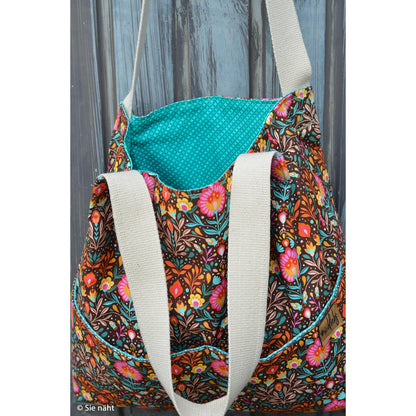 Robuster Baumwoll-Canvas mit buntem Folk-Blumenmuster im Retro- und Boho-Stil auf dunklem Hintergrund – ideal für Taschen, Dekorationen und kreative Nähprojekte.