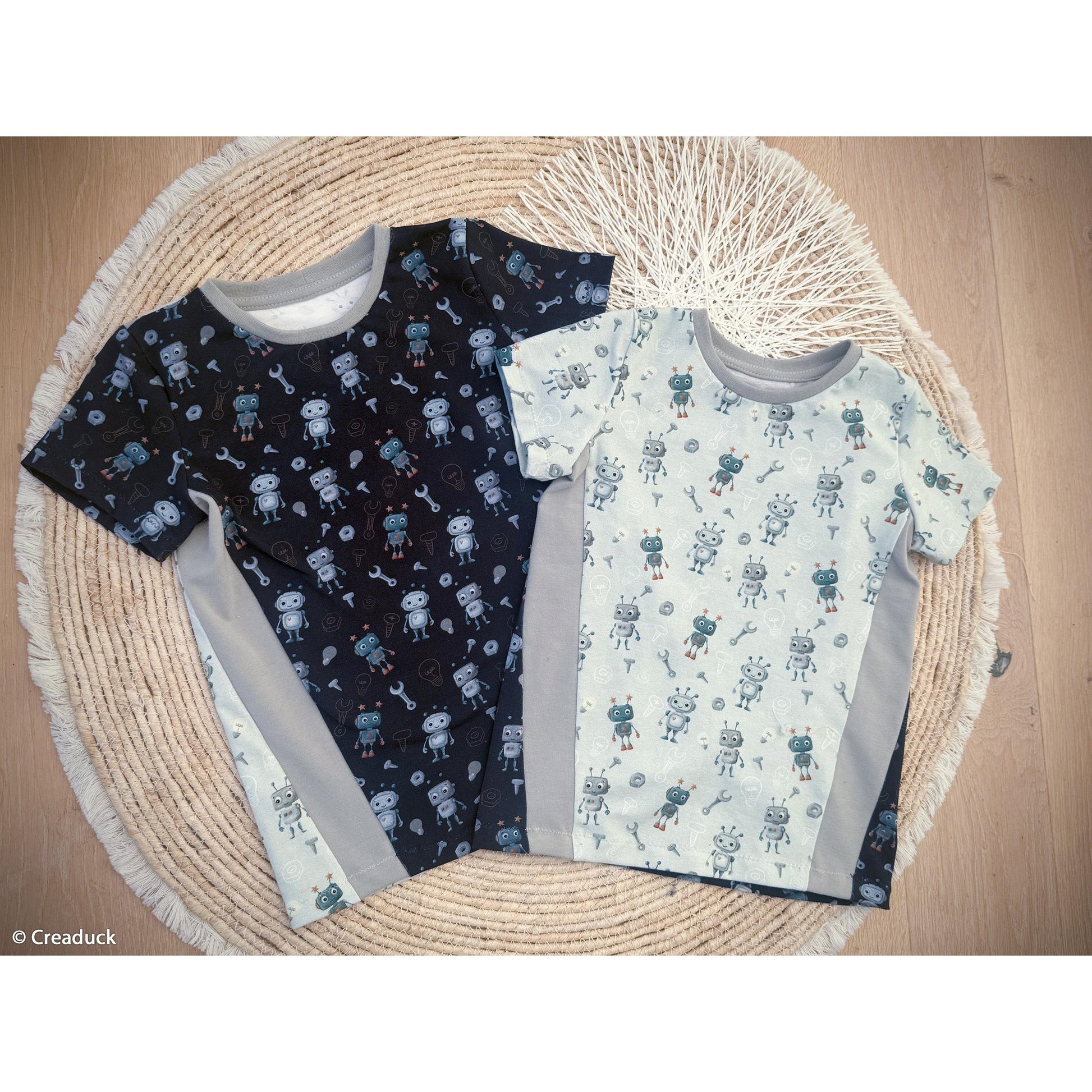 Hellblauer Baumwolljersey mit niedlichen Robotern, Werkzeugen und Technik-Motiven – Design „Hello Robot“ von Mrs. Mint Design für Swafing