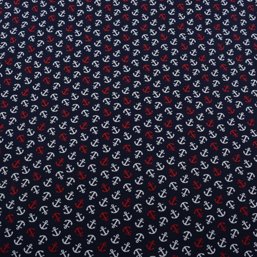 Dunkelblauer Baumwolljersey mit roten und weißen Ankern im maritimen Design.