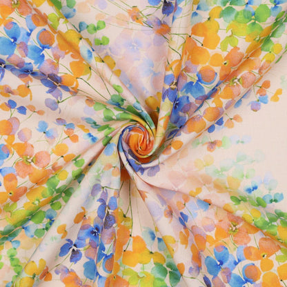 Leichte Radiance Viskose mit farbenfrohem Blätter-Digitalprint in Blau, Gelb, Grün und Apricot – ideal für sommerliche Kleidung.
