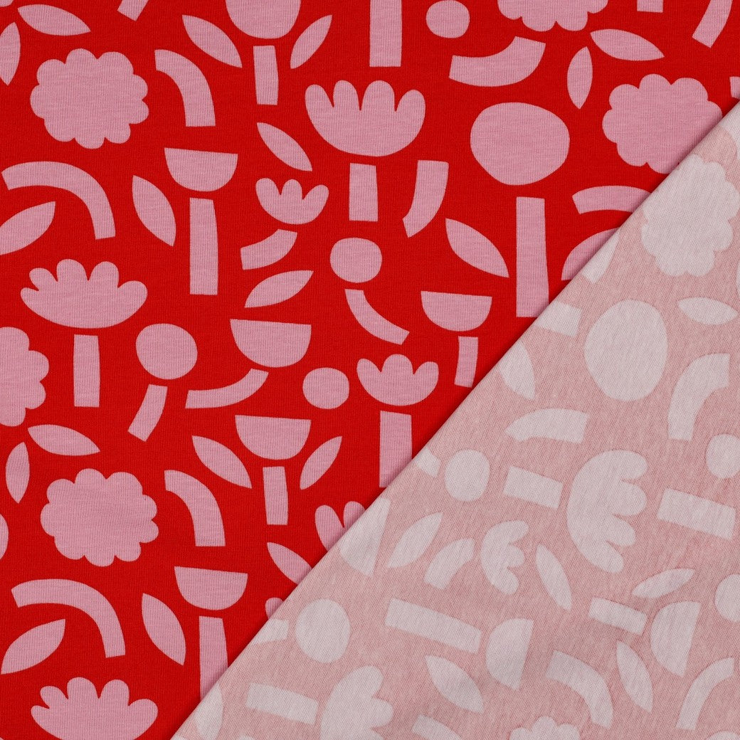 Grafischer Jersey Stoff mit rosa Blumen auf rotem Hintergrund im Retro Design von Jennifer Bouron, GOTS Baumwolle elastisch
