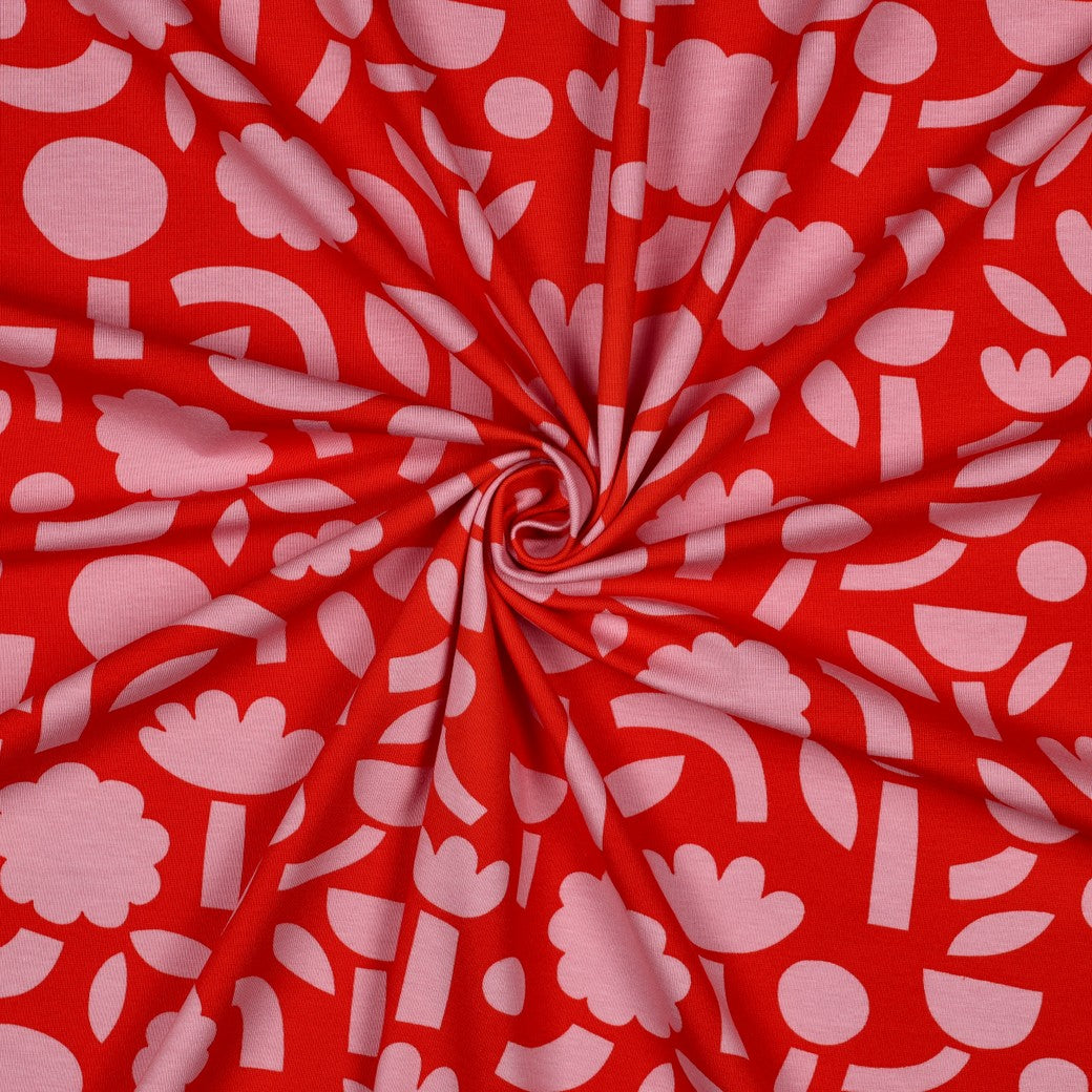 Grafischer Jersey Stoff mit rosa Blumen auf rotem Hintergrund im Retro Design von Jennifer Bouron, GOTS Baumwolle elastisch
