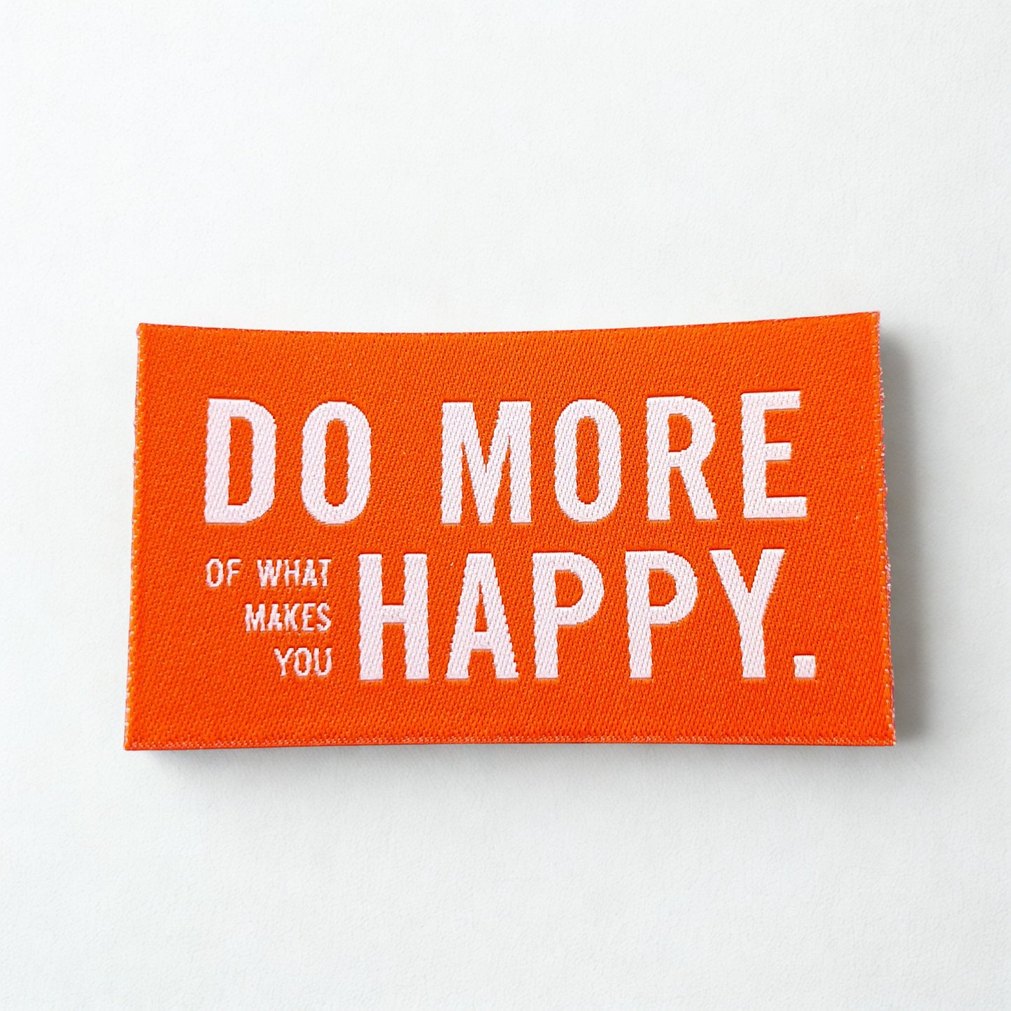 Aufbügelbare Weblabel von Prülla „Do more of what makes you happy“ in 4 Farben 4x7 cm